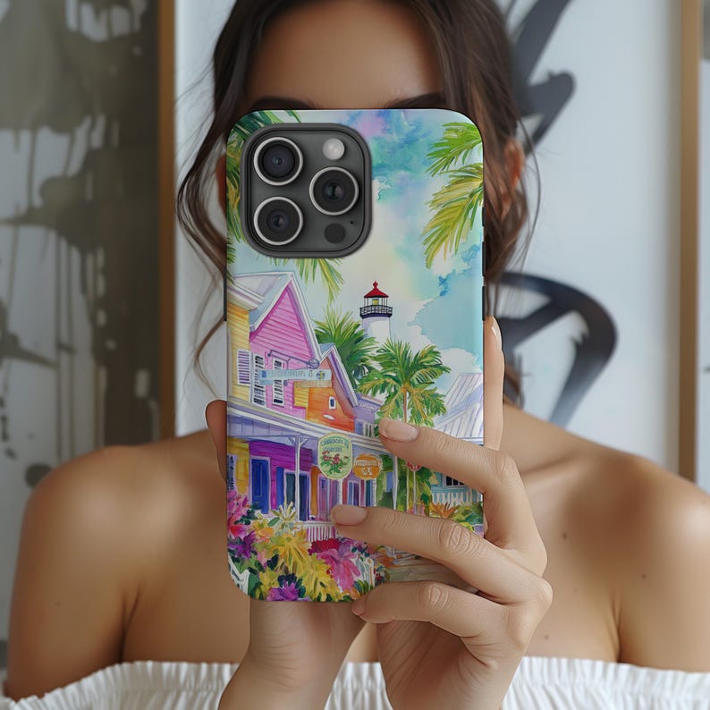 Key West phone case with pastel houses, palm trees, and a lighthouse under a bright blue sky.