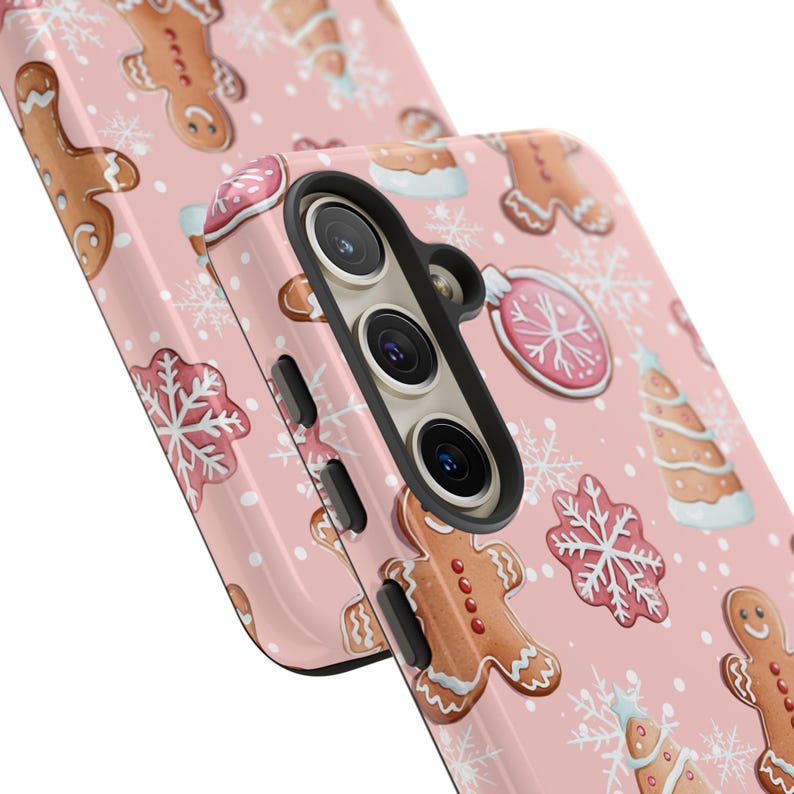 Cute and cozy holiday phone case featuring a gingerbread and snowflake pattern on pink.
