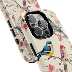 A beautifully designed floral and bird phone case that blends vintage charm with modern elegance.