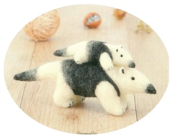 May include: Two needle felted anteaters, one riding on the back of the other. The larger anteater is white with black markings, and the smaller anteater is white.