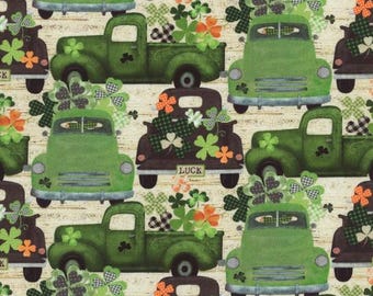 May include: A seamless pattern featuring green vintage pickup trucks filled with shamrocks and the word "LUCK" on the side. The trucks are on a beige background with a woodgrain texture.