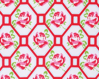 May include: White fabric with a repeating pattern of pink roses in red octagons. The octagons are outlined in red and white.