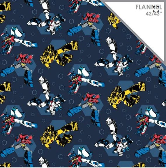 From Camelot Fabrics, Transformers on Navy blue Flannel. cotton FLANNEL, LAST 1/2 Yard