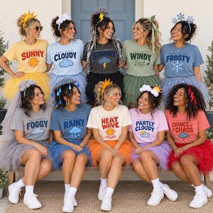 May include: A collection of ten t-shirts in various colours, each featuring a weather-themed graphic and text such as Sunny, Cloudy, Stormy, Windy, Frosty, Foggy, Rainy, Heat Wave, Partly Cloudy, and Chance of Chaos, paired with matching tulle skirts.