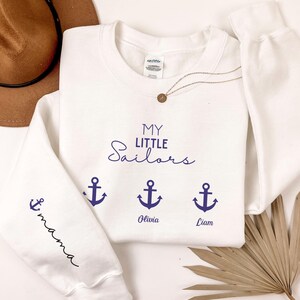 Custom This Grandma Wears Her Heart On Her Sleeve Sweatshirt, Personalized Mimi Hoodie With Grandchilds Names, Nana Outfit, Mothers Day Gift
