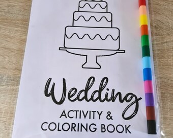 May include: A black and white coloring book with a wedding cake and the text "Wedding Activity & Coloring Book". A rainbow colored pencil is included.