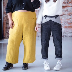 May include: Two people wearing different styles of trousers. One person is wearing a black cardigan and yellow linen trousers. The other person is wearing a white sweater and black and grey trousers.
