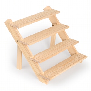 May include: A wooden tiered display stand with four shelves. The stand is made of natural wood and has a rustic look.