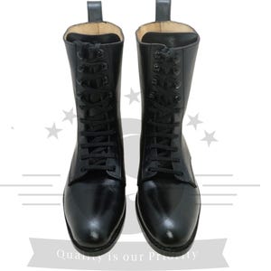 May include: Pair of black leather lace-up boots with a pointed toe.