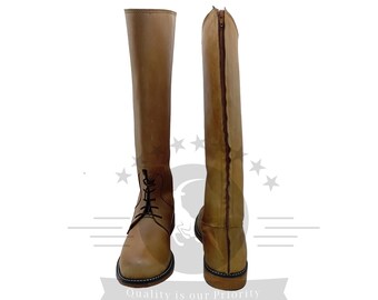 May include: A pair of brown leather riding boots with a zipper on the back and laces on the front. The boots have a black sole and a brown leather heel.