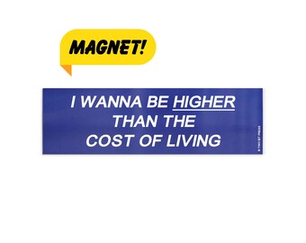 May include: A blue rectangular magnet with the text "I WANNA BE HIGHER THAN THE COST OF LIVING" in white. A yellow speech bubble-shaped magnet above reads "MAGNET!" in black.