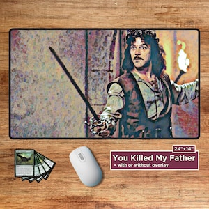 May include: Rectangular mouse pad featuring a stylized image of a man holding a sword and a torch. The mouse pad has the text "You Killed My Father" and measures 24" x 14". A white mouse and a deck of cards are also visible.