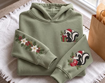 Embroidered Christmas Skunk Hoodie, Winter Floral Sleeve Sweatshirt, Holiday Animal Santa Hat Pullover, Festive Wildlife Xmas Gift For Her