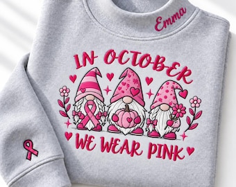 Custom In October We Wear Pink Sweatshirt, Breast Cancer Pink Gnomes Crewneck, Custom Sleeve Name Collar Shirt Cancer Awareness Fighter Gift
