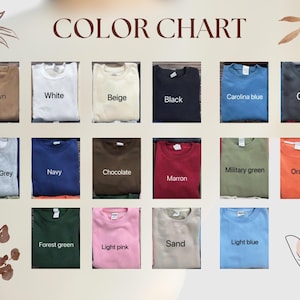May include: A color chart displays various sweatshirt colors, including brown, white, beige, black, Carolina blue, and grey. Additional colors are sports grey, navy, chocolate, maroon, military green, and orange. The chart also shows forest green, light pink, sand, and light blue.