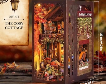 May include: A DIY kit for "The Cosy Cottage" miniature scene. The brown wooden structure features a detailed interior with a balcony, furniture, and autumn foliage. Dimensions are 4.33 inches wide, 7.09 inches deep, and 9.05 inches tall. The text "Twilight Cottage" is visible.