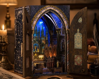 May include: A wooden book nook diorama featuring an open gothic cathedral interior with blue LED lighting, intricate architectural details, and miniature figures. The exterior is dark blue with gold star patterns and ornate door panels.