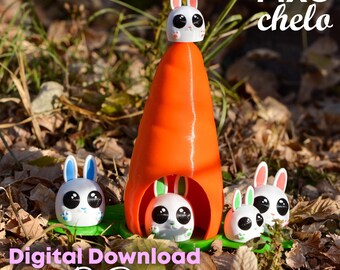 May include: A 3D printed carrot-shaped house with four white bunny figurines. The bunny on top of the house has black eyes and a pink nose. The bunnies at the bottom of the house have blue, green, and white ears. The text "Pixo chelo" is in the upper right corner of the image. The text "Digital Download for 3D Printing" is at the bottom of the image.