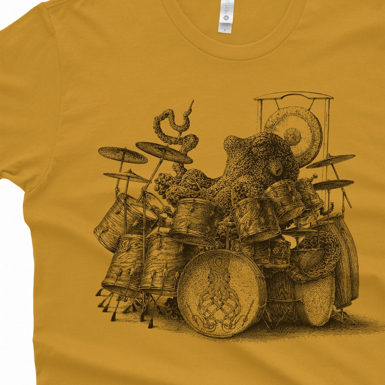 An octopus playing drums drawing screen printed onto a gold Tshirt.