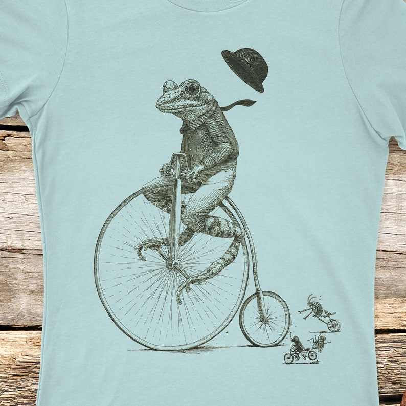 Women's Frog on a bike shirt, printed on Next Level Tees