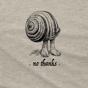 A black line drawing of a shell with human feet sticking out of it. The caption reads "no thanks". The background is heather gray