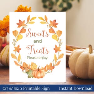 May include: A white sign with the words "Sweets and Treats" in elegant script, surrounded by a watercolor wreath of autumn leaves and a pumpkin. The sign also says "Please enjoy!"