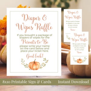 May include: A printable sign and cards for a diaper and wipes raffle. The sign features text in a decorative font, a watercolor pumpkin illustration, and the words "Diaper & Wipes Raffle". The cards have the same design. The sign is 8x10 inches.