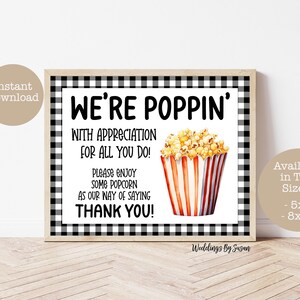 May include: Black and white checkered printable sign with the text "We're Poppin' with appreciation for all you do! Please enjoy some popcorn as our way of saying thank you!" and a cartoon image of a red and white striped popcorn container with popcorn inside. The sign is available in two sizes: 5x7 and 8x10 inches.