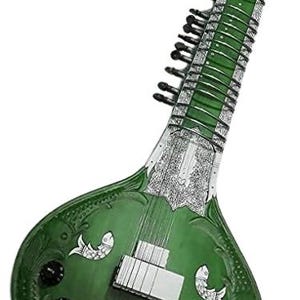 May include: A green sitar, a long-necked stringed instrument, with intricate carvings and decorative fish motifs. The instrument features a rounded body and a long neck with tuning pegs. The sitar's body is approximately 40 inches long.