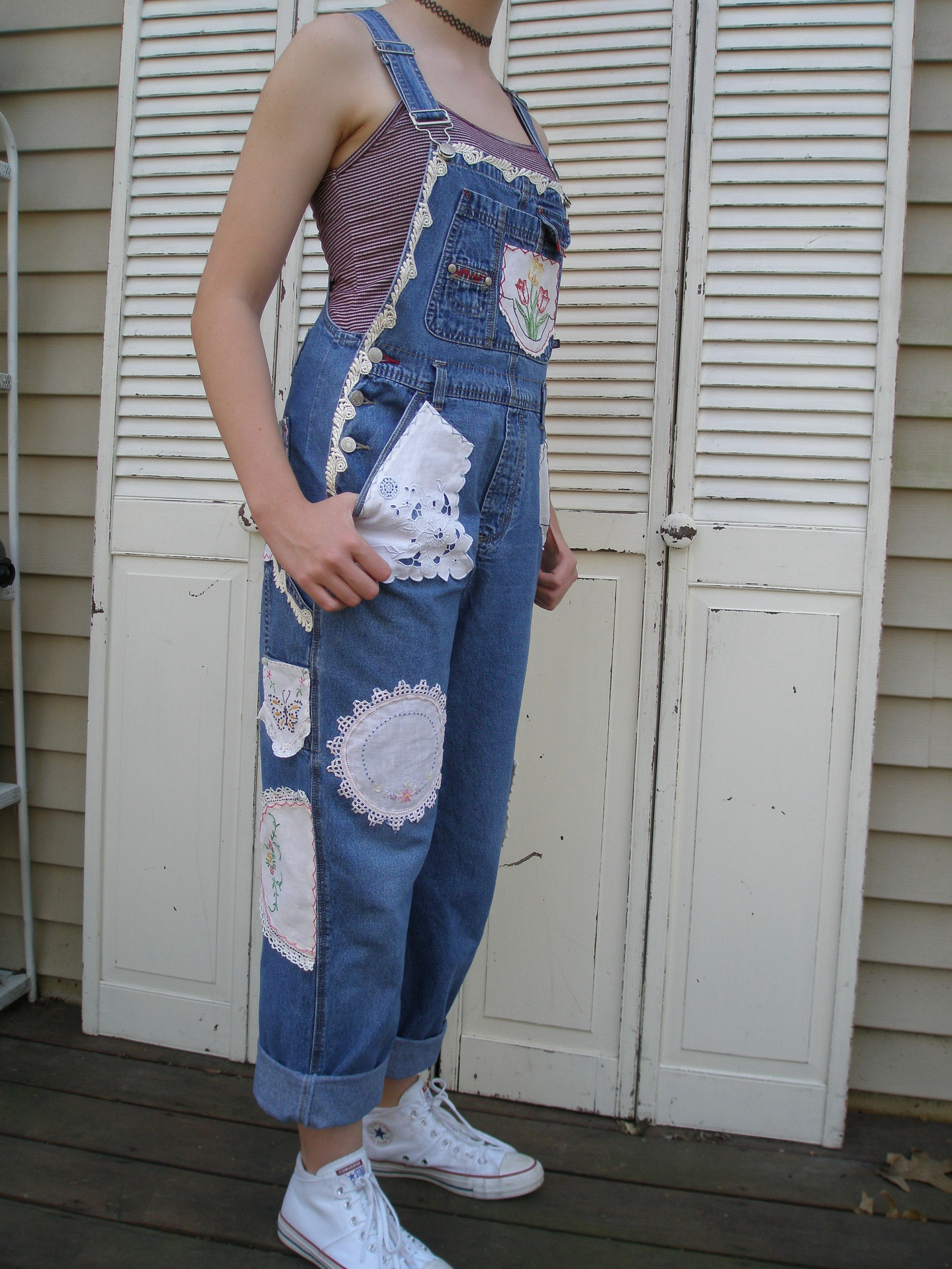 Black denim overalls upcycled with crochet doilies, fringe jacquard scrap  fabric, and tassel trim. • • • #overalls #upcycledclothing…