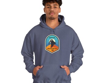 May include: A blue hooded sweatshirt with a front pocket and a drawstring hood. The sweatshirt features a patch with a mountain goat graphic and the text "G.D.O.A.T. Greatest Dad of All Time."