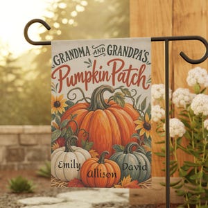 May include: A rectangular garden flag featuring a large orange pumpkin, a white pumpkin, and a blue-green pumpkin. The text reads "GRANDMA AND GRANDPA'S PUMPKIN PATCH" with the names "EMILY", "allison", and "DAVID" printed on the pumpkins.