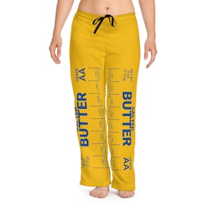 May include: Yellow sweatpants with a blue and white graphic print of a stick of butter with the text "SALTED BUTTER GRADE AA NET WT. 4 OZ (113 g)"