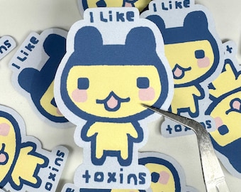 Mametchi Tamagotchi Sticker: I Like Toxins, Weatherproof Laptop Decal