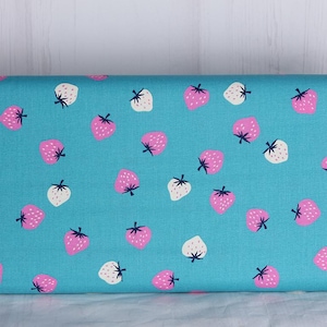 May include: A turquoise fabric featuring a repeating pattern of pink and white strawberries with black stems and leaves. The strawberries are scattered across the fabric, creating a playful and summery design.