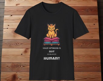 May include: Black t-shirt with a cartoon image of a cat wearing a crown and sitting on a throne. The text "Your opinion is not required HUMAN!" is printed below the image.