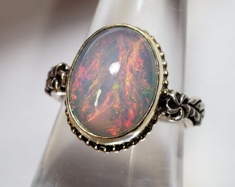 Ethiopian Opal Ring . Sterling Silver  & 14 K Yellow Gold . size  7.5. B210
