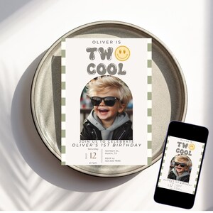 May include: A birthday invitation for a boy's 1st birthday party. The invitation features a photo of a boy wearing sunglasses and a leather jacket. The text on the invitation reads "Oliver is Two Cool" with a smiley face. The invitation is decorated with a green and white checkered pattern.