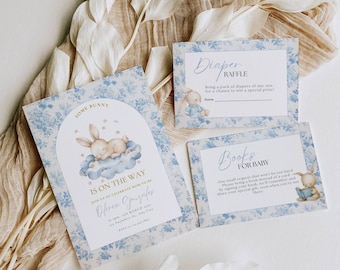 May include: A blue and white floral baby shower invitation featuring a bunny rabbit asleep on a cloud. The invitation reads "Some Bunny Is On The Way" and includes the name "Olivia Gonzalez".