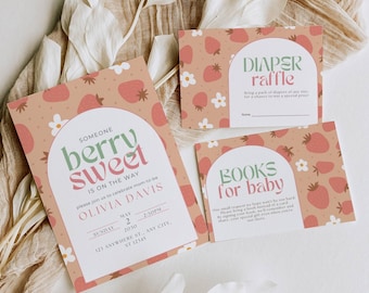 May include: A set of baby shower invitations and cards with a strawberry theme. The invitation features the text "berry sweet" and event details. The cards include "Diaper Raffle" and "Books for Baby" prompts, all in a soft color palette.