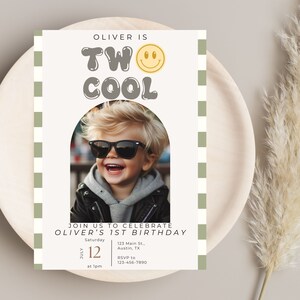 May include: A birthday invitation with a green and white checkered background. The invitation says "Oliver is Two Cool" with a smiley face and a photo of a boy wearing sunglasses. The invitation includes the date, time, and location of the party.