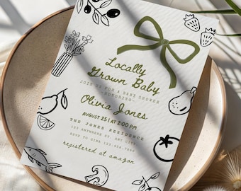 Op de afbeelding: Babyborrel uitnodiging met de tekst "Locally Grown Baby" en de naam "Olivia Jones". De uitnodiging bevat illustraties van fruit, groenten en een groene strik. De datum en tijd zijn 25 augustus om 14:00 uur.