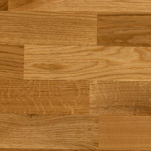 May include: A close-up of a wood floor with a natural finish. The wood planks are arranged in a staggered pattern, creating a rustic and elegant look.