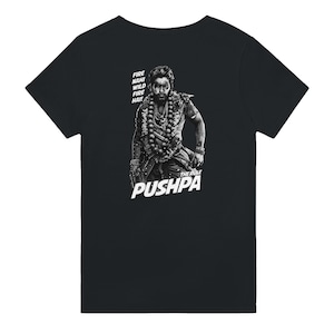 May include: Black t-shirt with a white graphic of a man with a beard and a necklace. The text "FIRE NAHI WILD FIRE HAI!" and "THE RULE PUSHPA" is printed on the shirt.