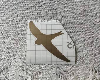 Good silouhette sticker of a bird in flight