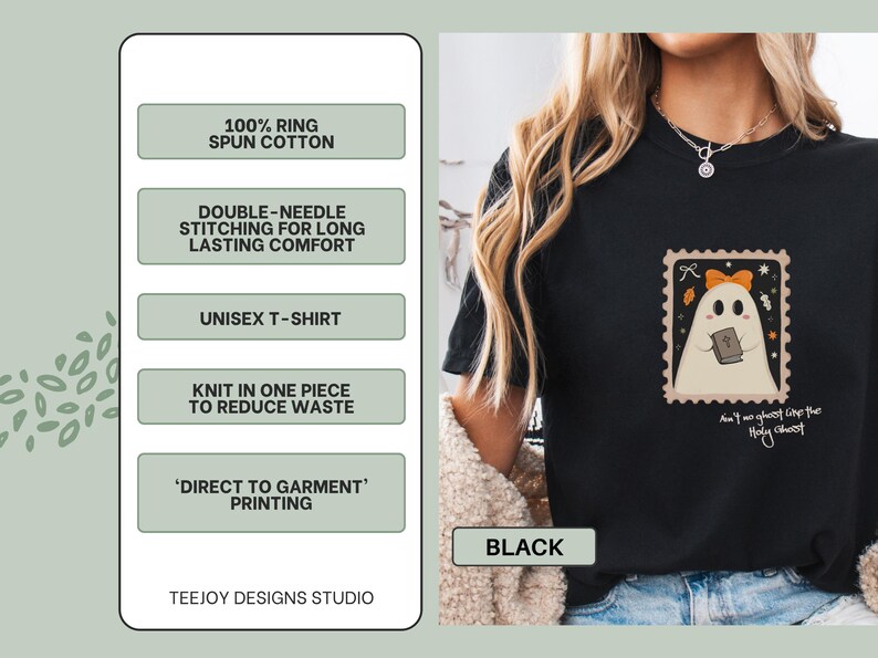 K&ouml;nnte beinhalten: Schwarzes Unisex-T-Shirt mit einem Geisterdesign in einem Briefmarkenrahmen. Der Geist tr&auml;gt eine orangefarbene Schleife und h&auml;lt ein Buch. Der Text auf dem Shirt lautet "Ain't no ghost like the Holy Ghost".