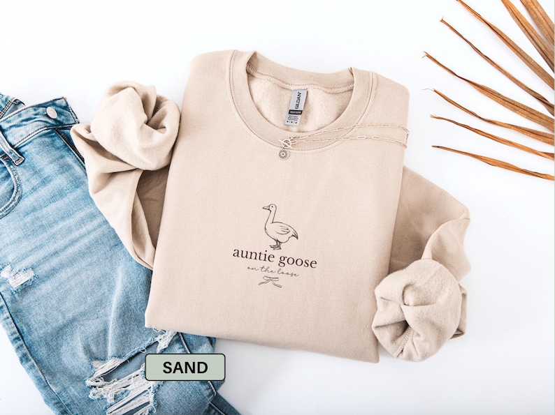 Funny Auntie crewneck sweatshirt with coquette goose design that says Auntie Goose on the Loose, cozy new aunt sweater and playful gift from niece