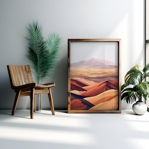 Puede incluir: Una impresi&oacute;n enmarcada de un paisaje des&eacute;rtico con una cordillera en el fondo. La impresi&oacute;n est&aacute; en un marco de madera y est&aacute; colgada en una pared blanca.