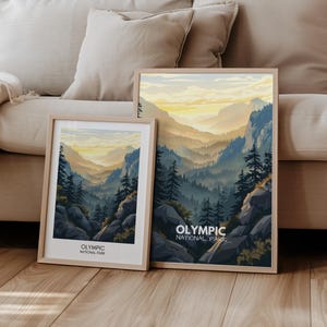 May include: Two framed prints of a mountain landscape with the text "Olympic National Park" at the bottom. The prints are in wooden frames and are hanging on a wall.