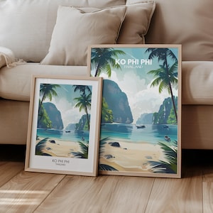 May include: Two framed illustrations of a tropical island scene with palm trees, turquoise water, and mountains. The text on the frames reads "KO PHI PHI THAILAND".